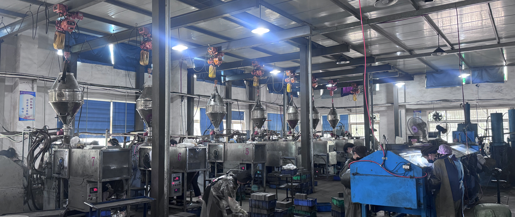 ASTROMAGNET production floor with sintering equipment and operators